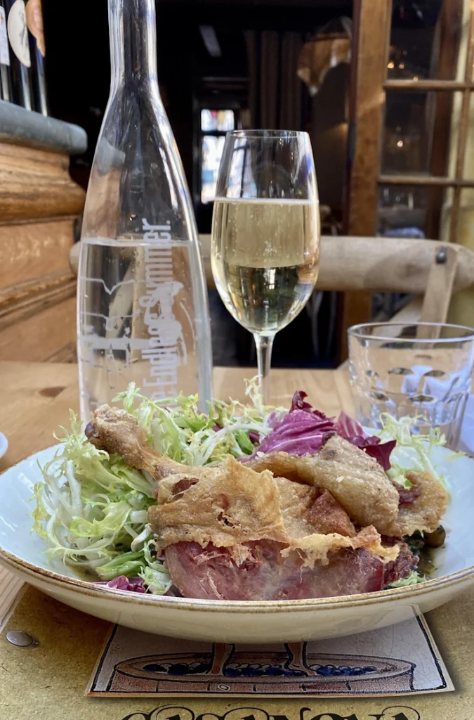 Gorgeous piece of flaky duck confit with Champagne and water.