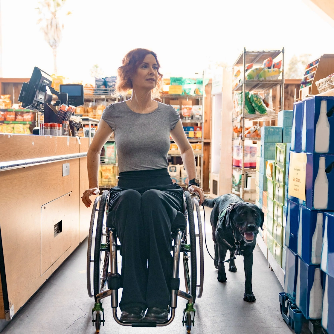 Chanda and Kestrel roll through a shop.